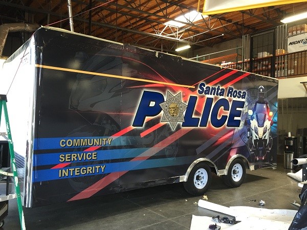 Photo of Santa Rosa Police complete digital print wrap on a large box trailer.