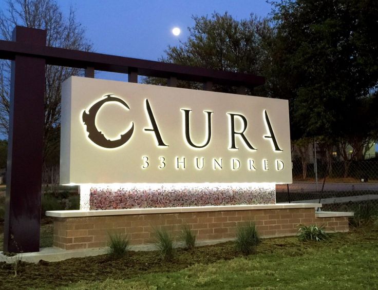 Signage minument in a box with backlit lettering illumination the business name.